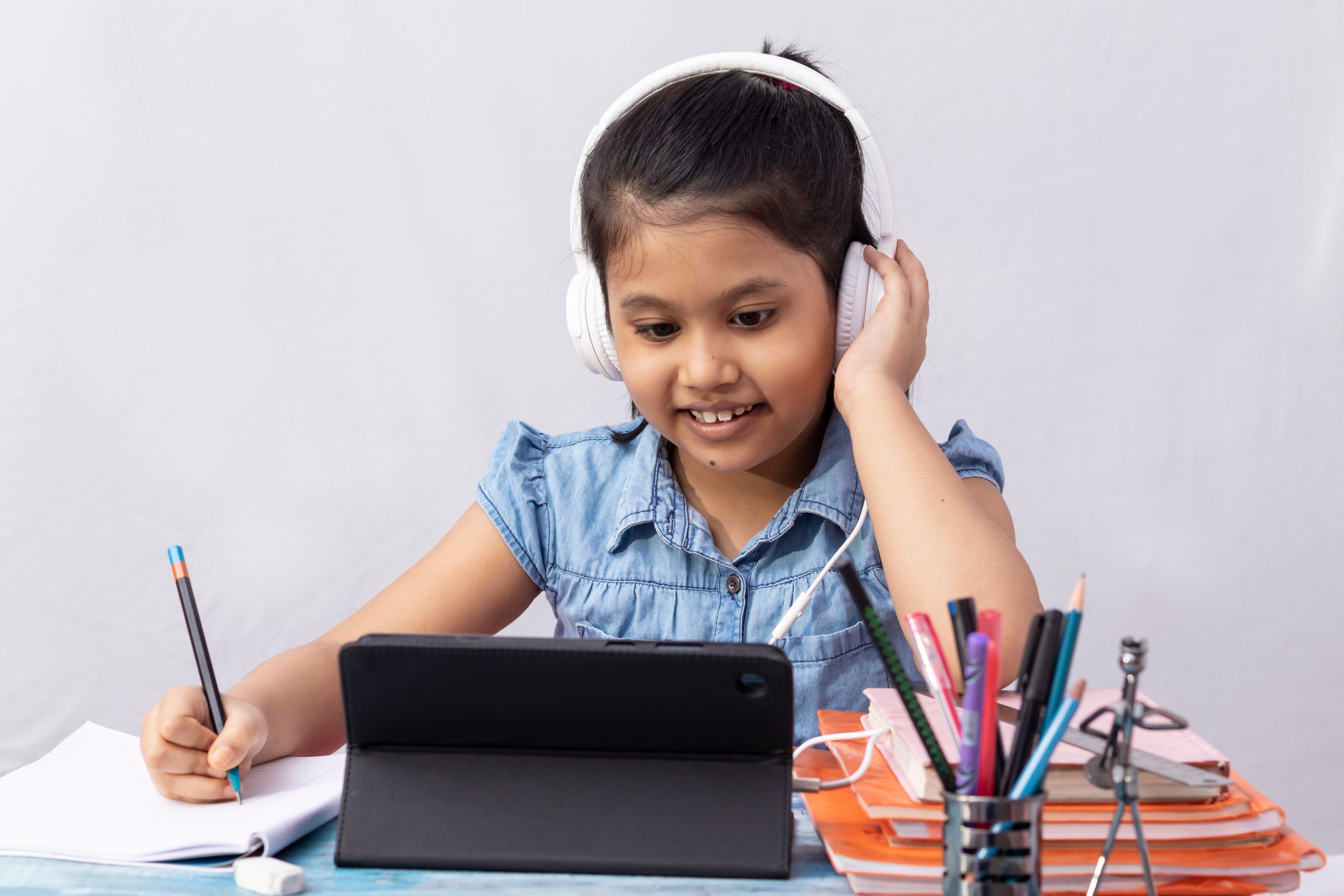 A,Pretty,Indian,Girl,Child,Attending,Online,Class,With,Tablet